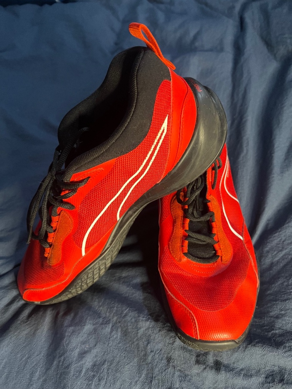 PUMA Playmaker Pro men’s 12 basketball shoes in High Risk Red / Jet Black